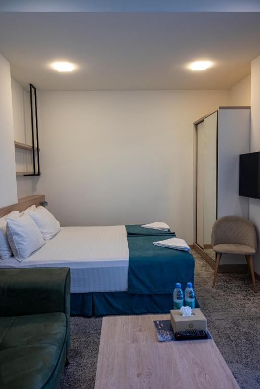 TV a/nebo společenská místnost v ubytování Rooftop Hotel