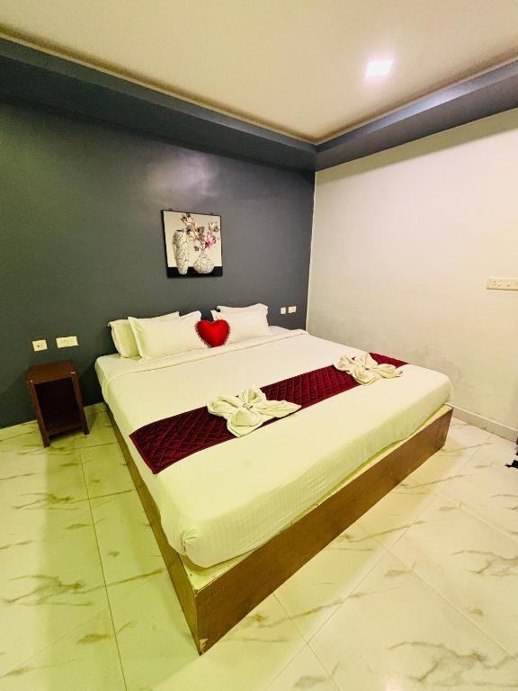 Ліжко або ліжка в номері The Elite Beachview