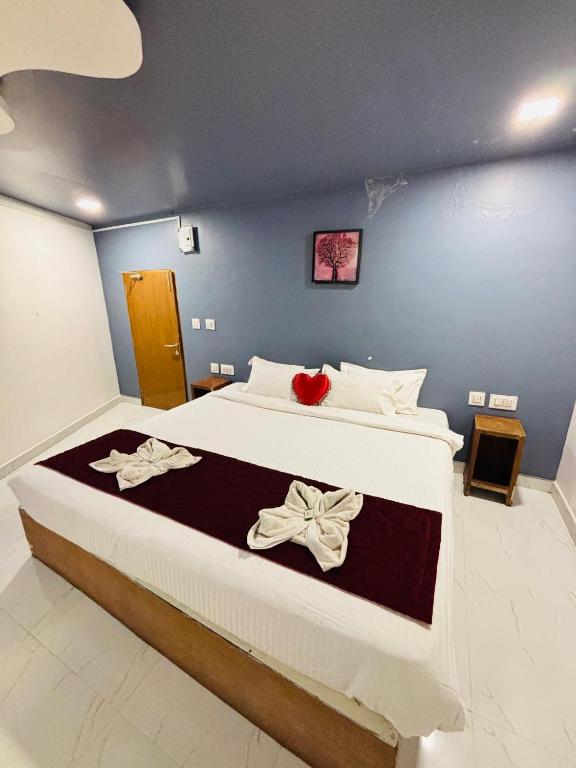 Ліжко або ліжка в номері The Elite Beachview
