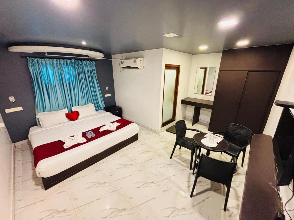 Ліжко або ліжка в номері The Elite Beachview