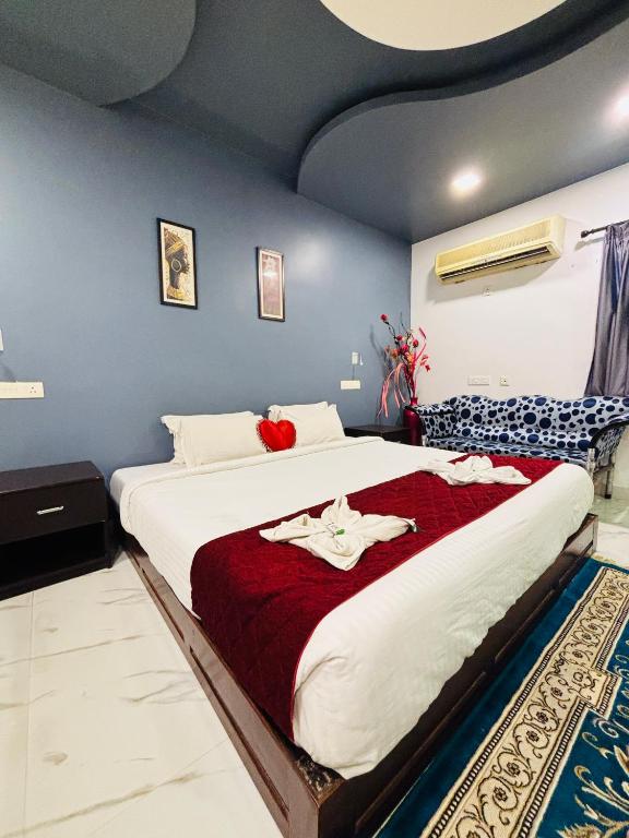 Ліжко або ліжка в номері The Elite Beachview