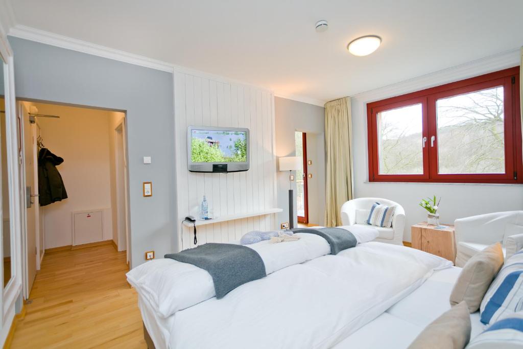Postel nebo postele na pokoji v ubytování Romantik Hotel Schloss Ranzow