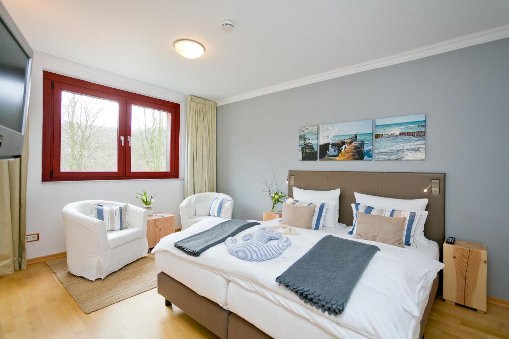 Postel nebo postele na pokoji v ubytování Romantik Hotel Schloss Ranzow