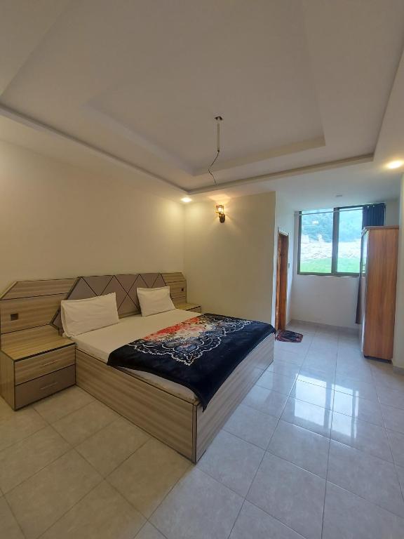 Postel nebo postele na pokoji v ubytování Farooq hotel