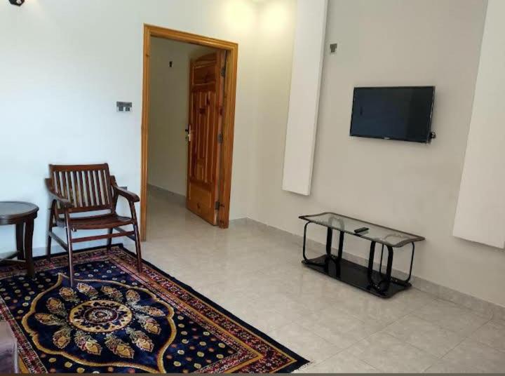 TV a/nebo společenská místnost v ubytování Farooq hotel