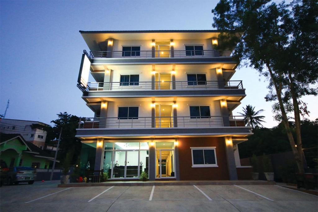a large white building with lights on it at Baan Samrarn in Krabi town
