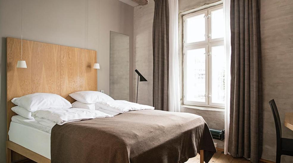 Postel nebo postele na pokoji v ubytování Hotel Brosundet