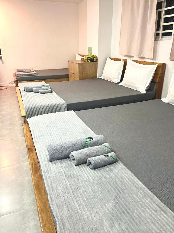 Postel nebo postele na pokoji v ubytování MEKONG HUB Hotel