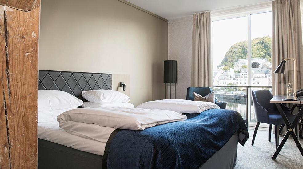 Postel nebo postele na pokoji v ubytování Hotel Brosundet