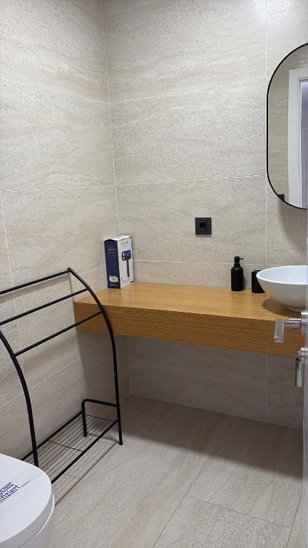 a bathroom with a sink and a toilet at LHOME CÁDIZ in Cádiz