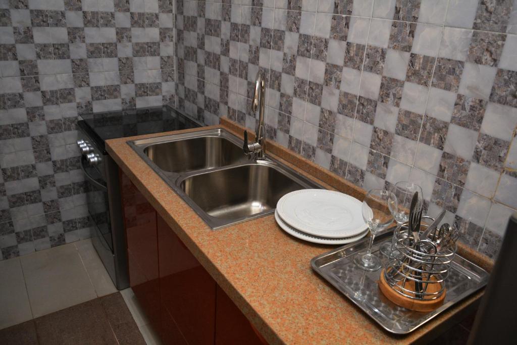 Kuchyň nebo kuchyňský kout v ubytování Aishar Residence Flat 3c