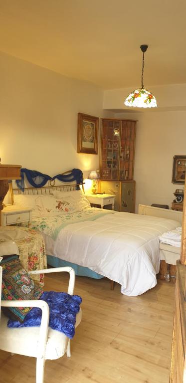 Łóżko lub łóżka w pokoju w obiekcie B&B I Colori dell'Arcobaleno