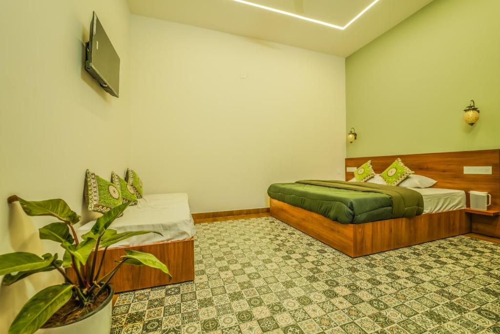 Postel nebo postele na pokoji v ubytování Swasta Royal Villas Wayanad