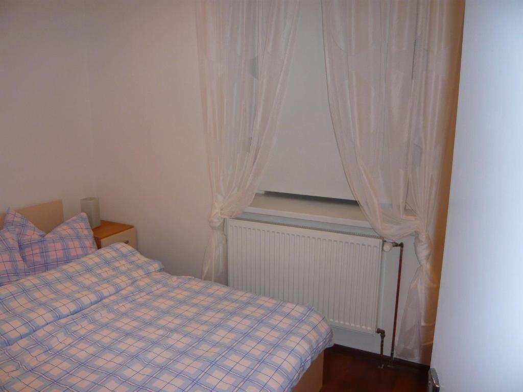 Postel nebo postele na pokoji v ubytování Apartmány Liška