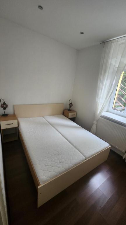 Postel nebo postele na pokoji v ubytování Apartmány Liška