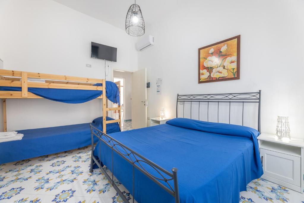 Postel nebo postele na pokoji v ubytování Le camere di Riva delle donne by Vivimy