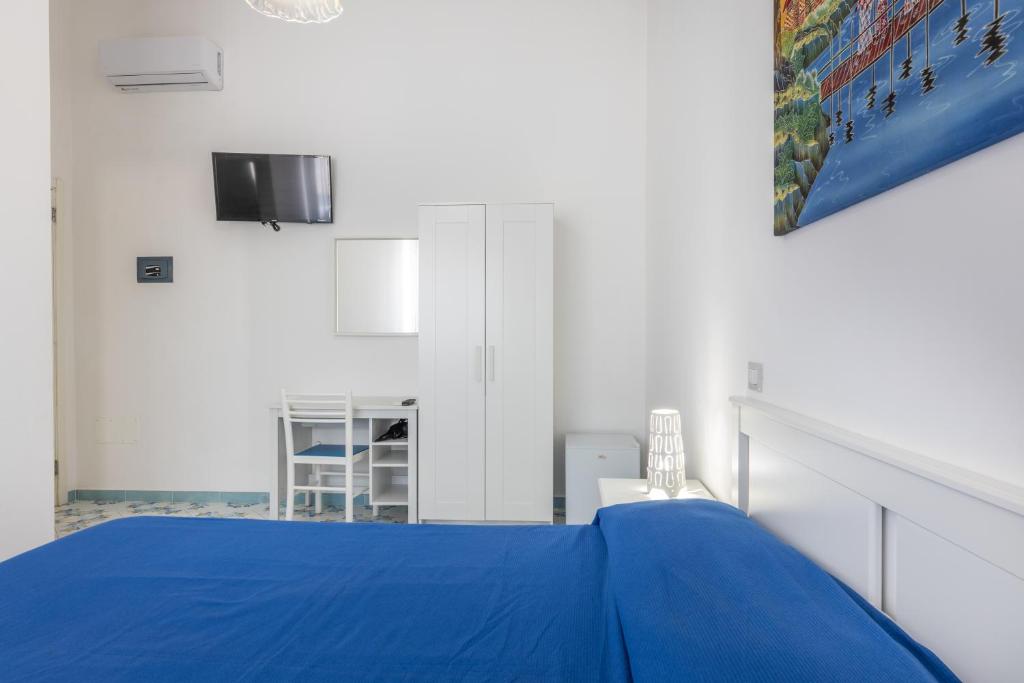Postel nebo postele na pokoji v ubytování Le camere di Riva delle donne by Vivimy