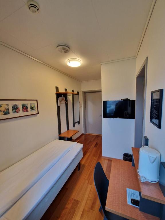 TV a/nebo společenská místnost v ubytování Bjugn Hotell