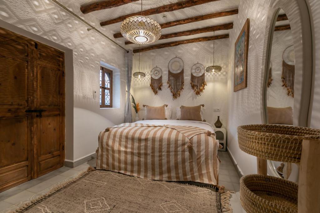 Postel nebo postele na pokoji v ubytování Riad Lamalika