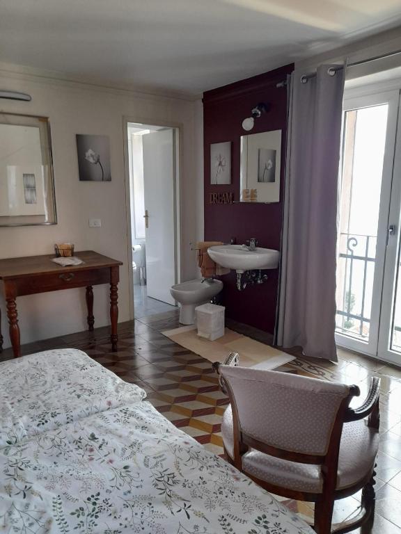 Postel nebo postele na pokoji v ubytování Albergo Milano 1920