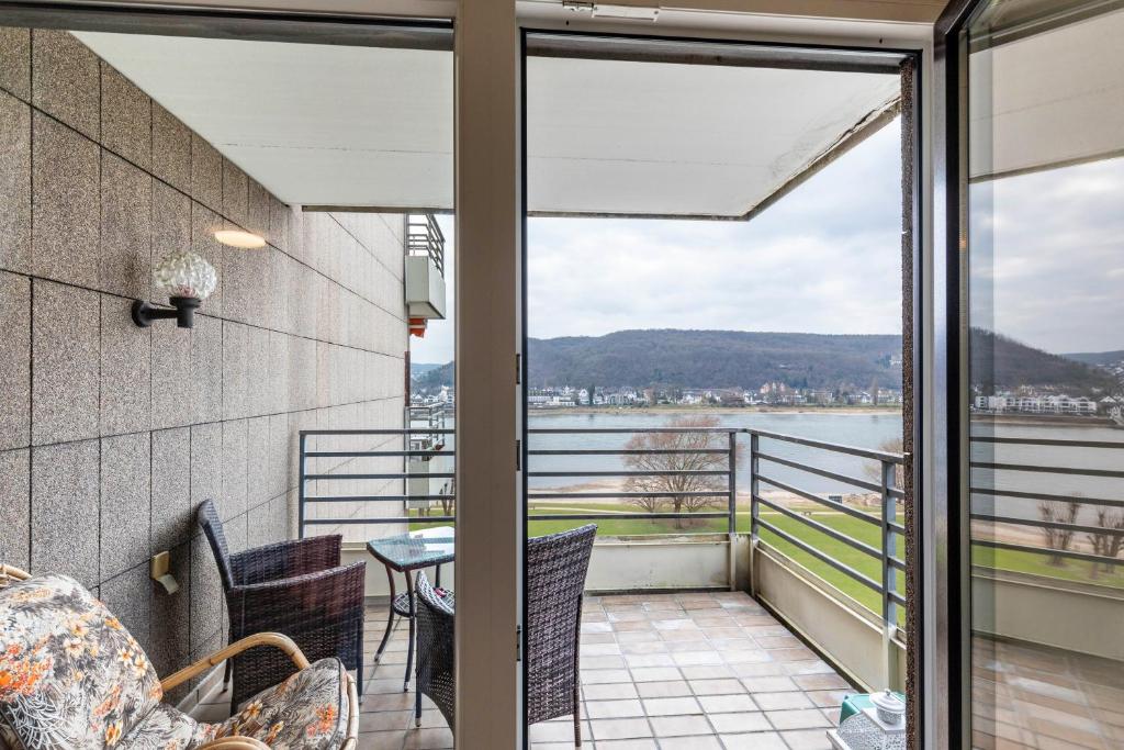 a balcony with a view of the water at Rheinapartment Dependance 8 in Bad Hönningen