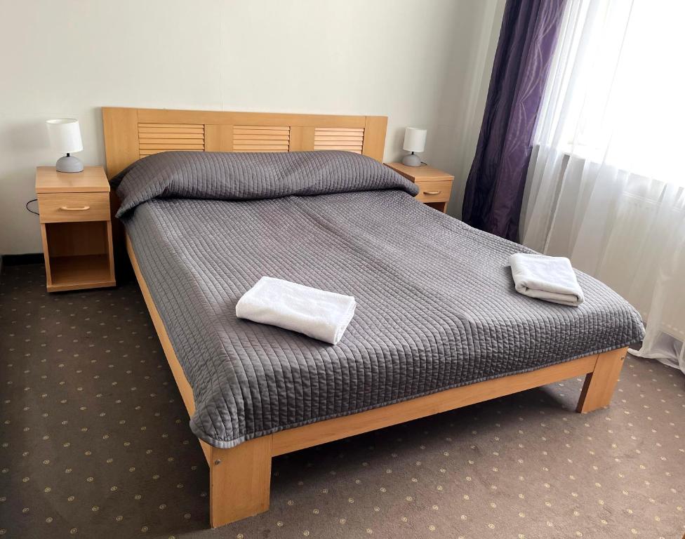 Posteľ alebo postele v izbe v ubytovaní Hotel Dom Polonii