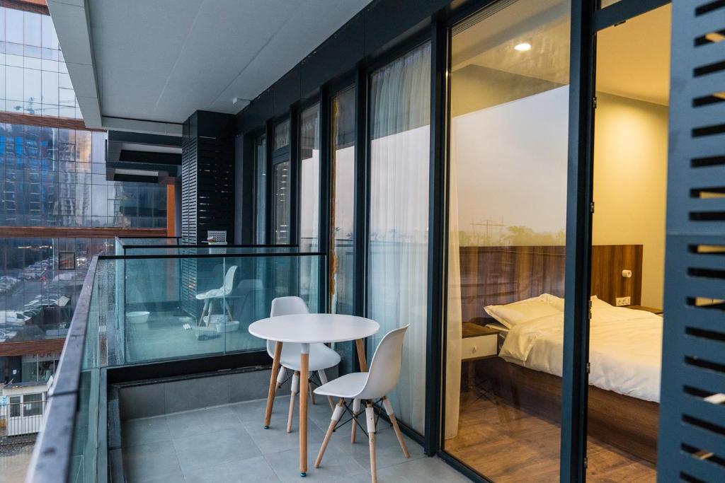 Ένα ή περισσότερα κρεβάτια σε δωμάτιο στο White Tower Apartments