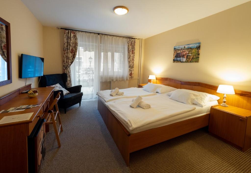 Posteľ alebo postele v izbe v ubytovaní Hotel Cabernet