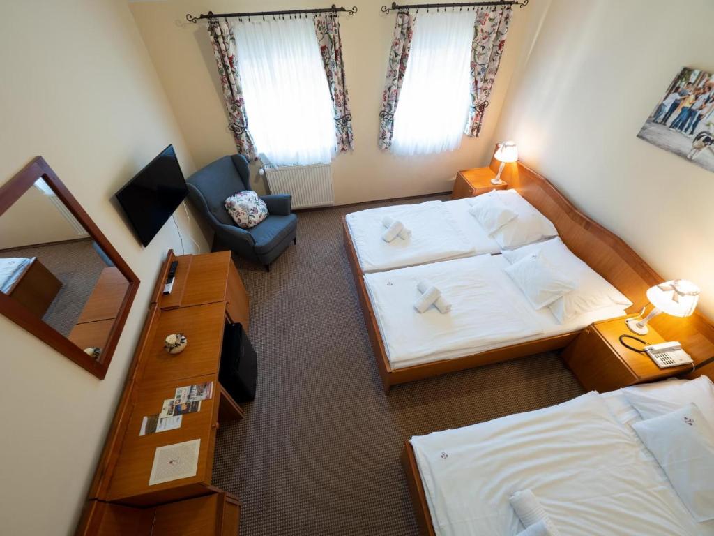 Posteľ alebo postele v izbe v ubytovaní Hotel Cabernet