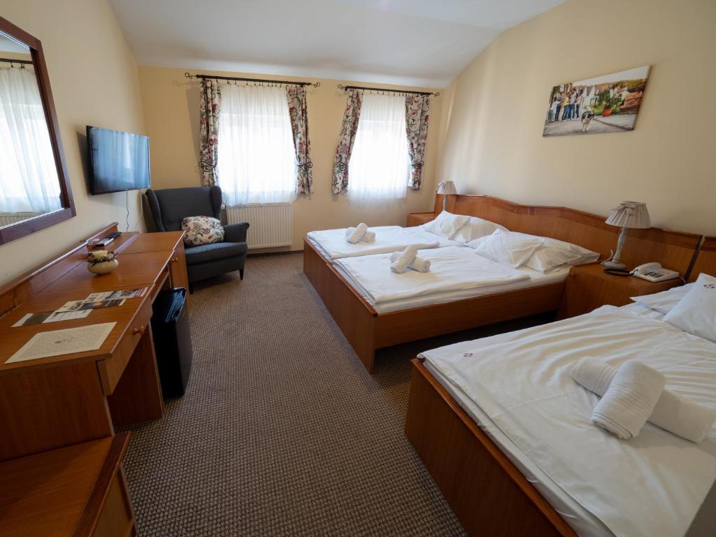 Posteľ alebo postele v izbe v ubytovaní Hotel Cabernet