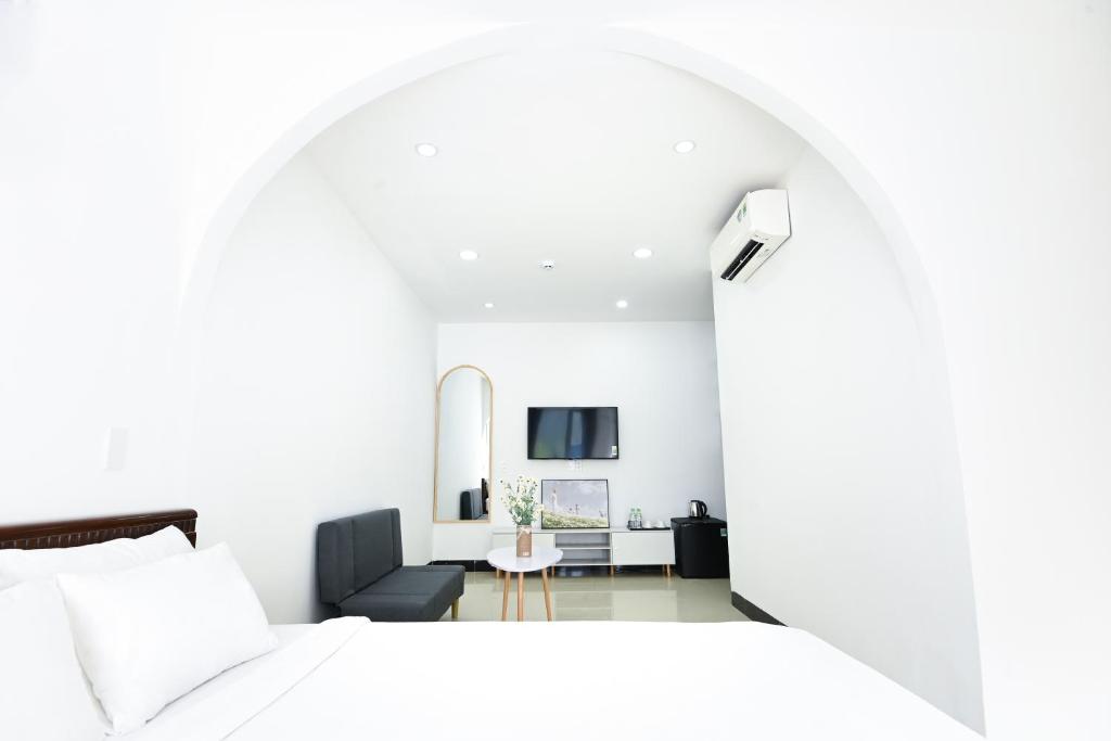 TV a/nebo společenská místnost v ubytování Horizon Côn Đảo Hotel