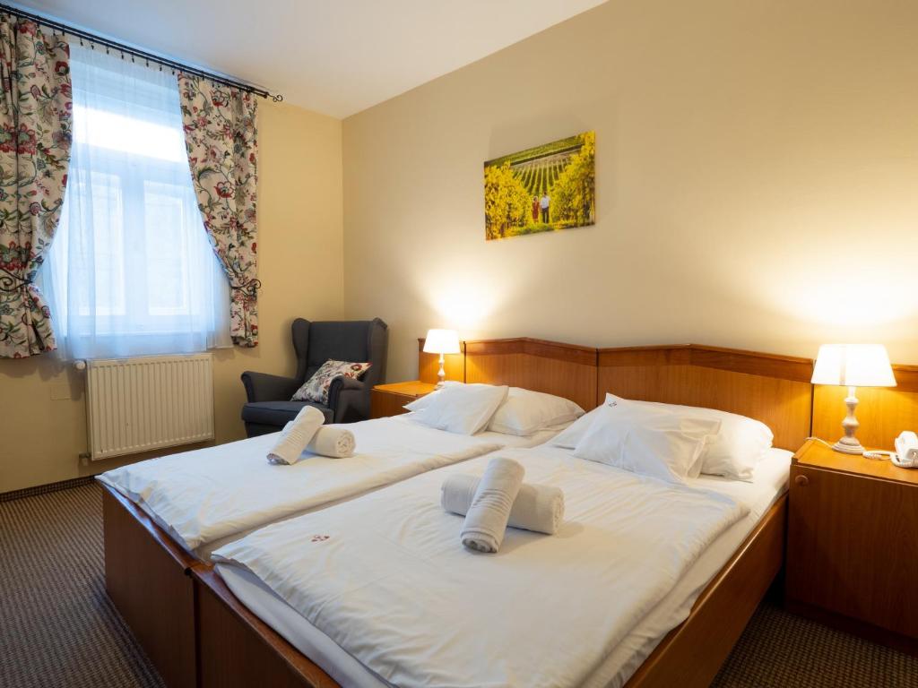 Posteľ alebo postele v izbe v ubytovaní Hotel Cabernet