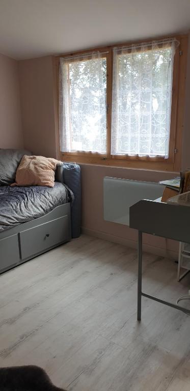 Postel nebo postele na pokoji v ubytování Mini châlet vue mer
