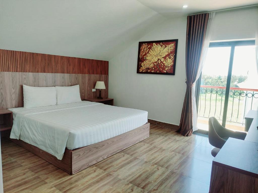 Postel nebo postele na pokoji v ubytování An Villa Beach Paradise
