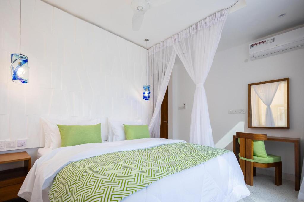 Postel nebo postele na pokoji v ubytování Amkia Villas Diani