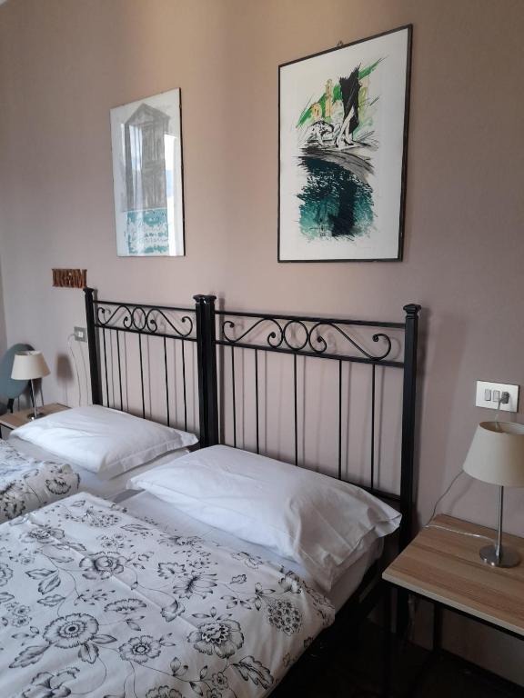 Postel nebo postele na pokoji v ubytování Albergo Milano 1920