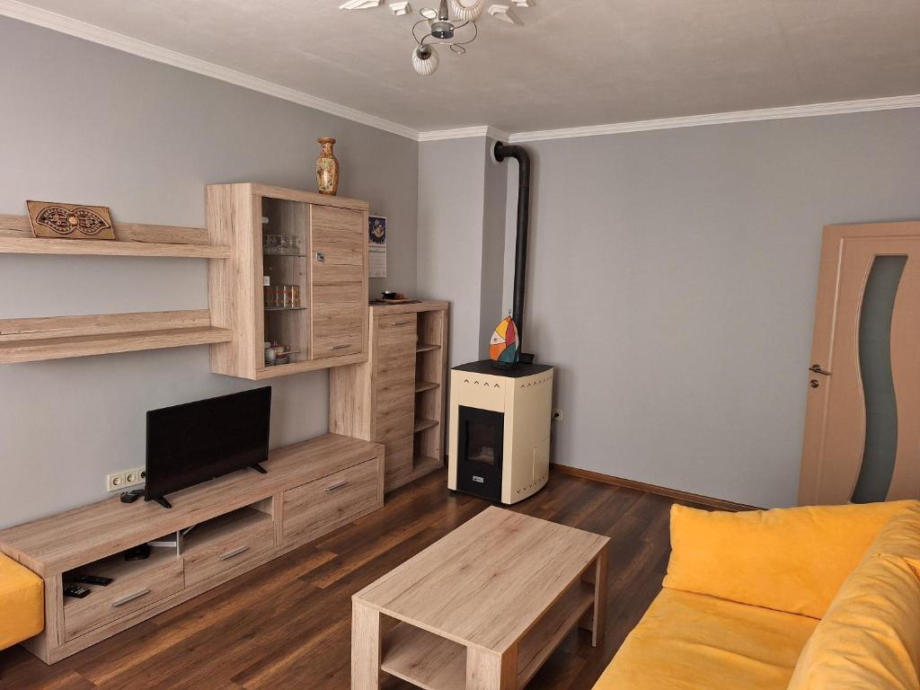 Μια τηλεόραση ή/και κέντρο ψυχαγωγίας στο Cosy flat close to the center