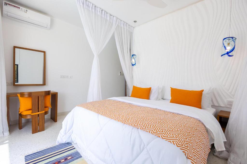 Postel nebo postele na pokoji v ubytování Amkia Villas Diani