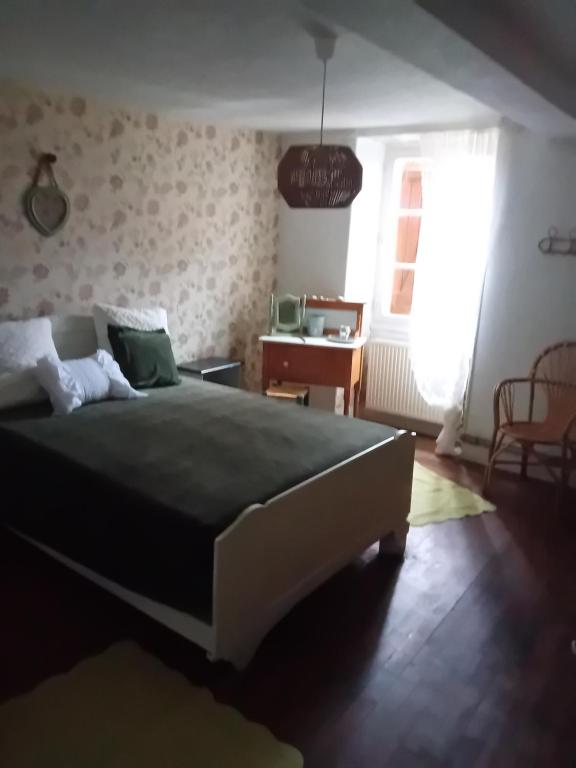 Postel nebo postele na pokoji v ubytování Gite du vieil acacia