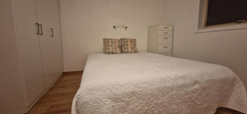 Ένα ή περισσότερα κρεβάτια σε δωμάτιο στο Cozy flat in the heart of Bergen