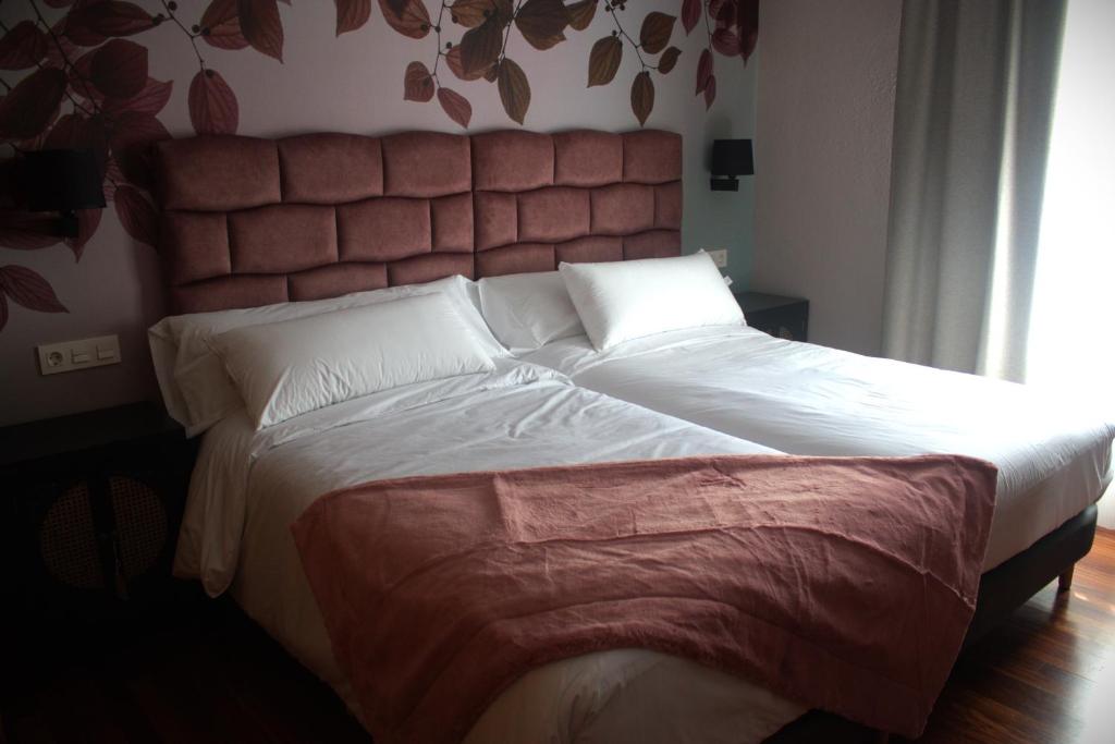 Postel nebo postele na pokoji v ubytování Hotel Bermeo