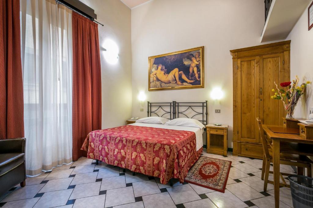 Postel nebo postele na pokoji v ubytování Hotel Collodi Firenze