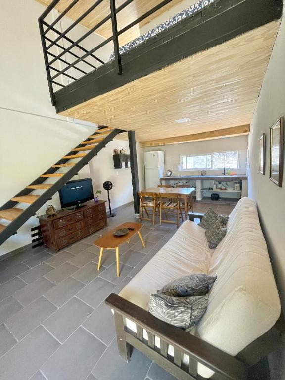 a living room with a couch and a table at Loft Jujuy 2 Departamento Céntrico in San Salvador de Jujuy