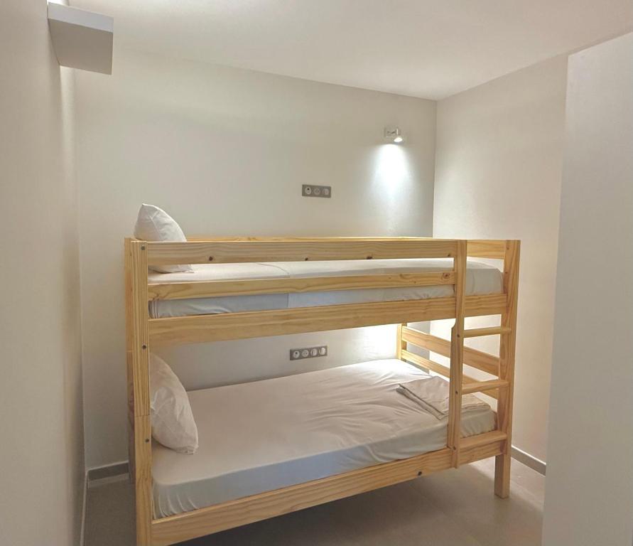 Postel nebo postele na pokoji v ubytování Courbaril Hôtel