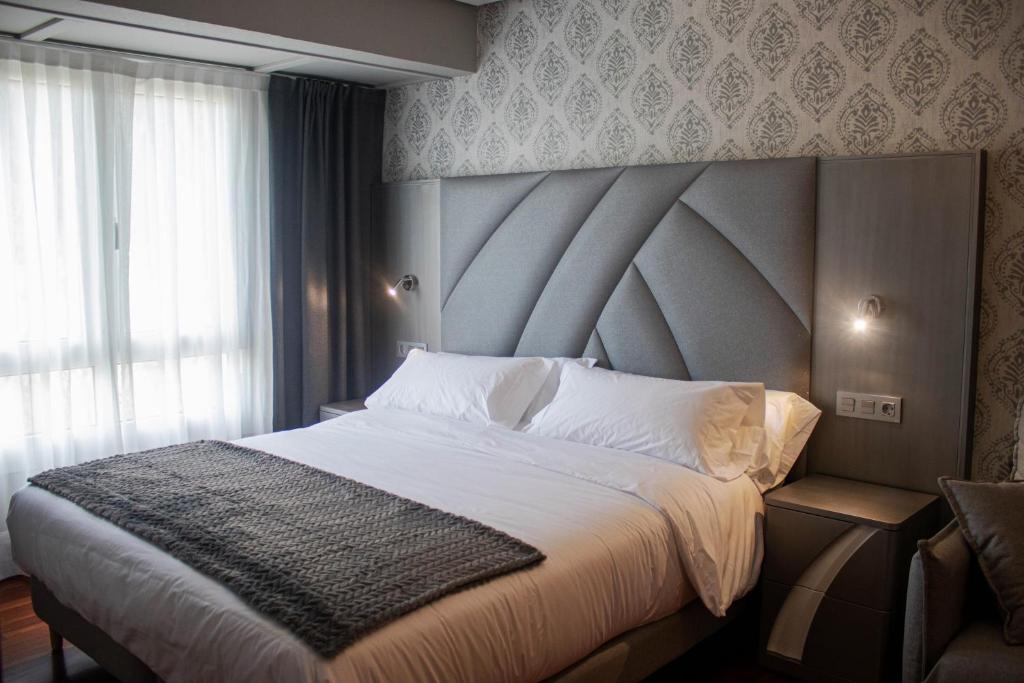 Postel nebo postele na pokoji v ubytování Hotel Bermeo