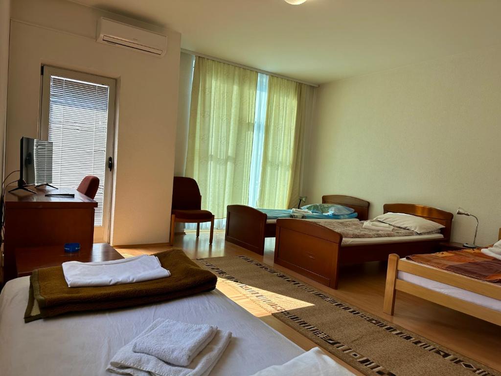 Postel nebo postele na pokoji v ubytování Wellness & Spa - Hotel Oaza
