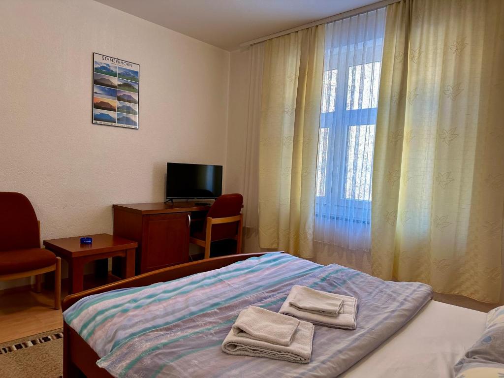 Postel nebo postele na pokoji v ubytování Wellness & Spa - Hotel Oaza