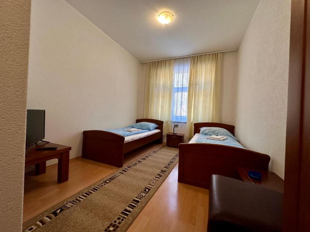 Postel nebo postele na pokoji v ubytování Wellness & Spa - Hotel Oaza