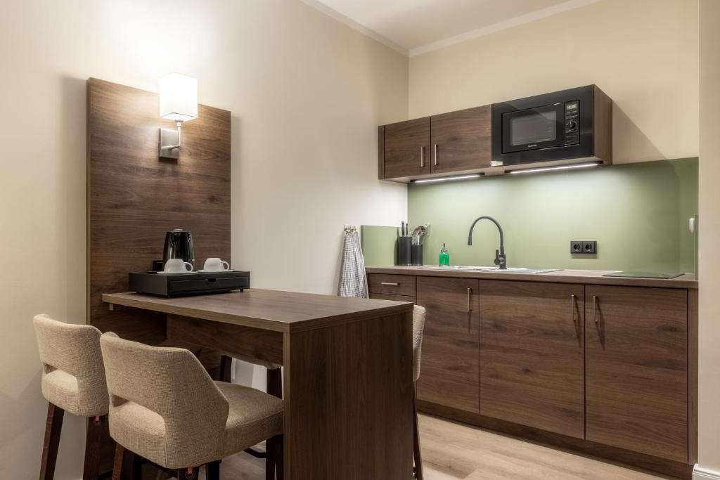 Kuchyň nebo kuchyňský kout v ubytování Hotel Ohlenhoff