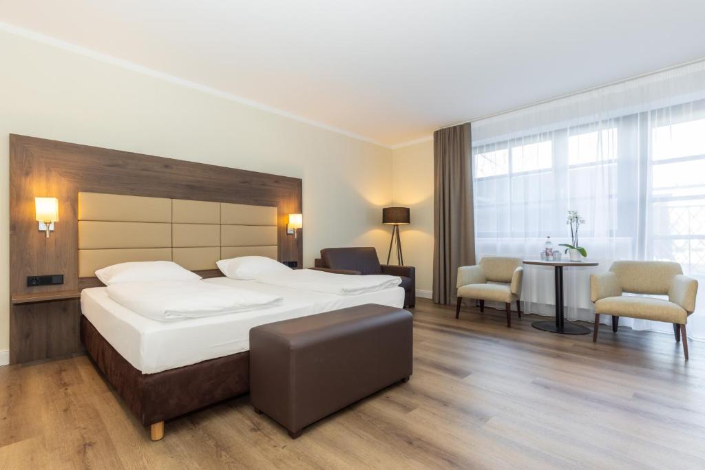 Postel nebo postele na pokoji v ubytování Hotel Ohlenhoff